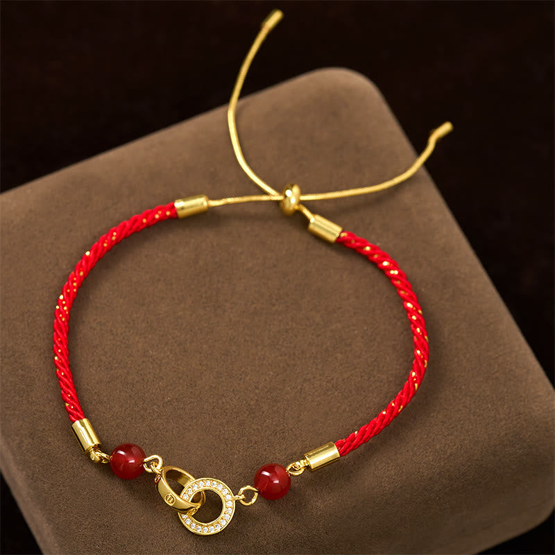 Braccialetto di protezione in corda rossa placcato oro con fibbie per la pace collegate in Buddha Stones - image 1