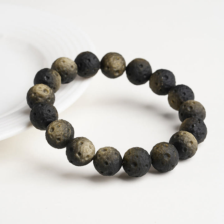 Braccialetto di protezione con perle rotonde in ossidiana dorata e argento naturale Buddha Stones - image 7