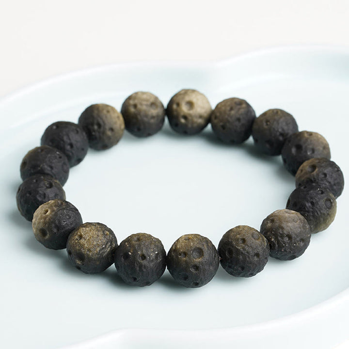 Braccialetto di protezione con perle rotonde in ossidiana dorata e argento naturale Buddha Stones - image 10