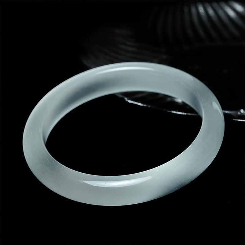 Bracciale rigido spirituale con occhio di gatto bianco Buddha Stones - image 1