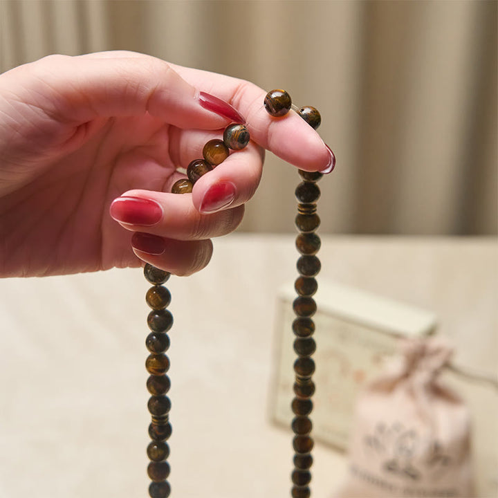 Mala con perline di occhio di tigre, simbolo di loto Buddha Stones - image 4