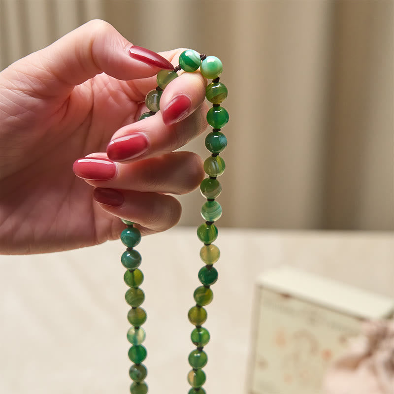 Braccialetto di protezione con Buddha Stones e nappa di malachite - image 4