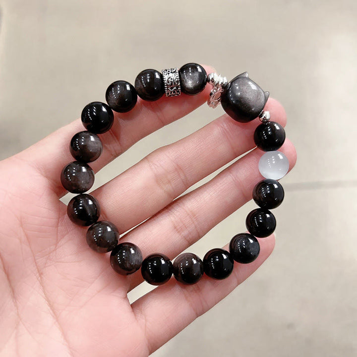 Buddha Stones Braccialetto positivo con testa di gatto e occhio di gatto bianco in ossidiana argentata lucida - Perlina di ossidiana argentata lucida, misura 10 mm (circonferenza del polso: 14-15 cm) - image 14