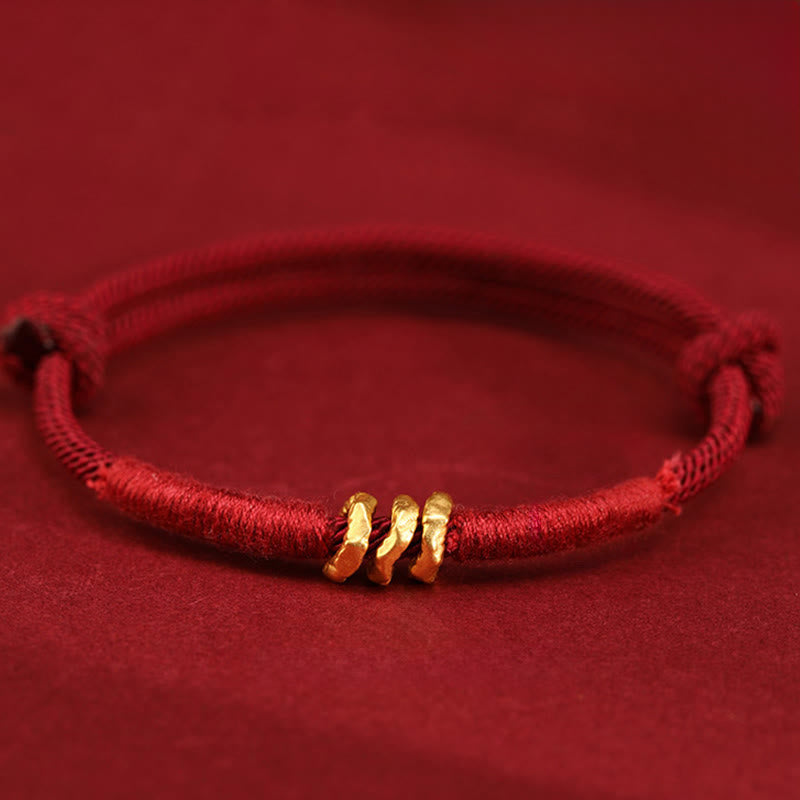Buddha Stones Braccialetto alla cavigliera in corda rossa intrecciata a mano con design ad anello in oro 999 - image 1