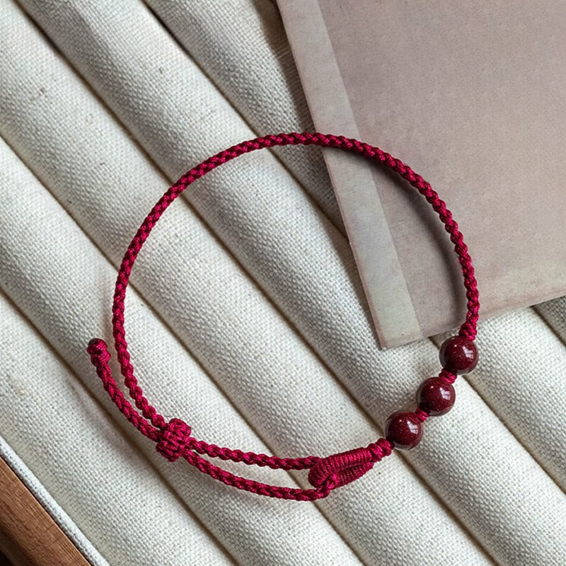 Buddha Stones Braccialetto di corda intrecciata con perline di cinabro fatte a mano e benedizione della calma - image 1