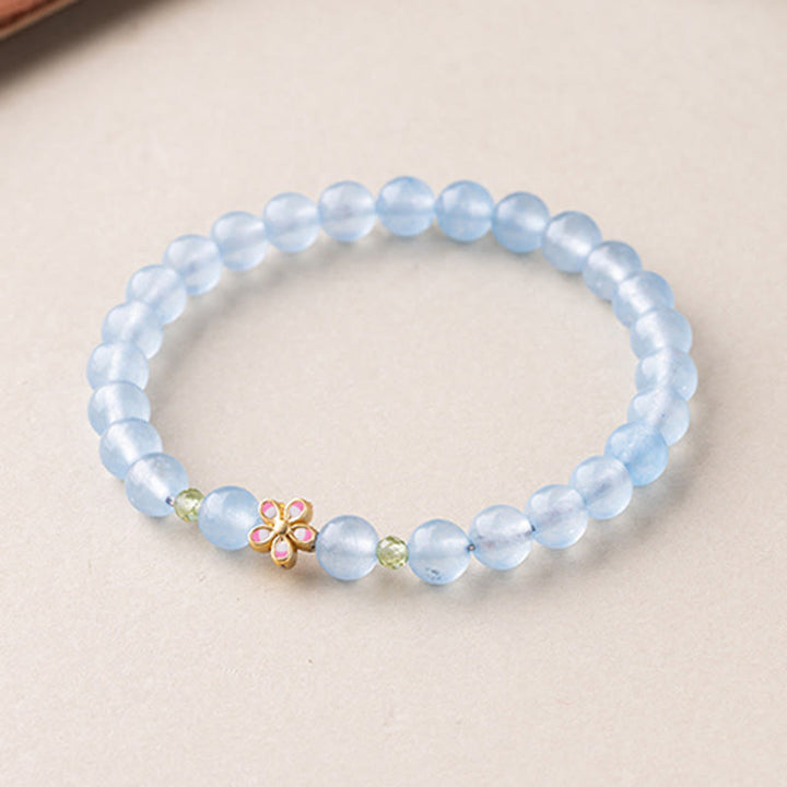 Buddha Stones Bracciale terapeutico floreale in rame placcato oro e acquamarina naturale - image 2