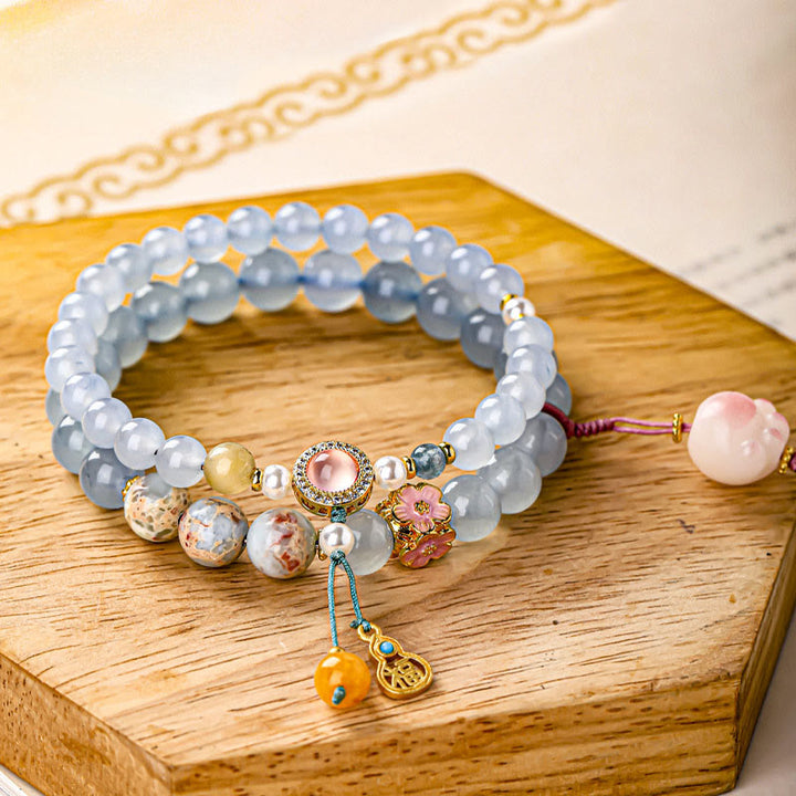 Buddha Stones Braccialetto curativo a forma di zampa di gatto con carattere Fu in calcedonio blu - Zampa di gatto (circonferenza del polso: 14-15 cm) - image 0