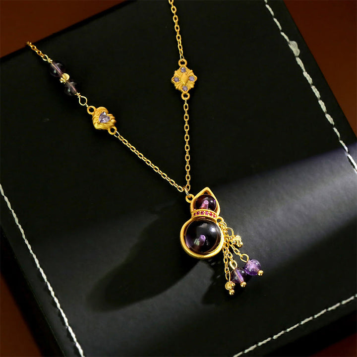 Buddha Stones Collana da meditazione con ciondolo a forma di zucca, nappa, ametista e catena in rame. - image 0