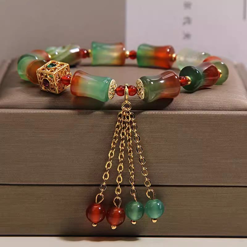 Buddha Stones Braccialetto con nappina, perline di bambù, agata pavone colorata e simbolo di coraggio - Agata pavone (circonferenza del polso 14-16 cm) - image 0