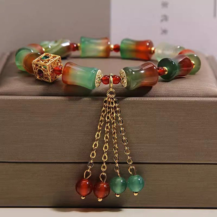 Buddha Stones Braccialetto con nappina, perline di bambù, agata pavone colorata e simbolo di coraggio - Agata pavone (circonferenza del polso 14-16 cm) - image 0