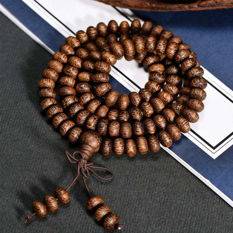 Buddha Stones Mala con 108 perline di legno testurizzate per un'energia calmante - image 2