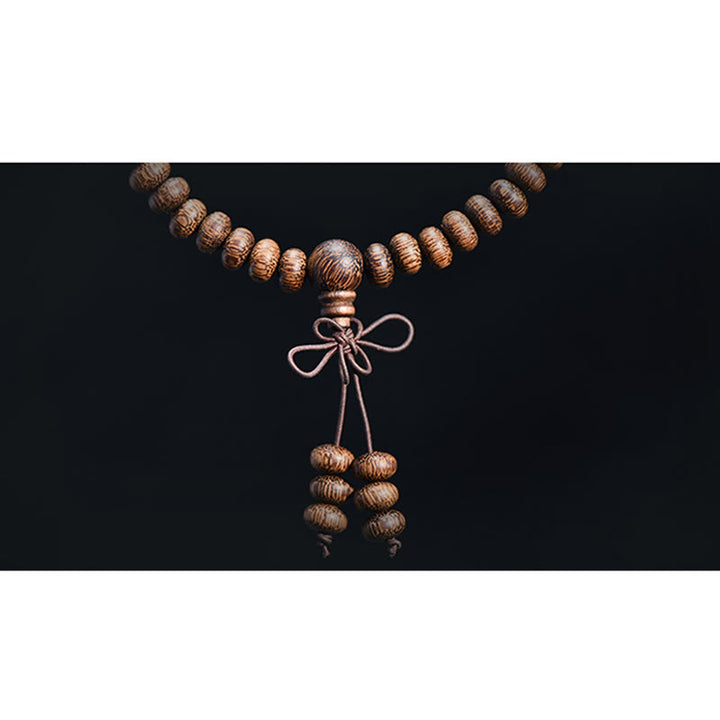 Buddha Stones Mala con 108 perline di legno testurizzate per un'energia calmante - image 10