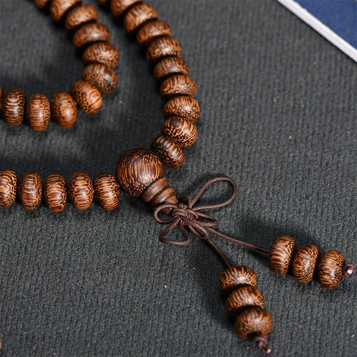 Buddha Stones Mala con 108 perline di legno testurizzate per un'energia calmante - image 7