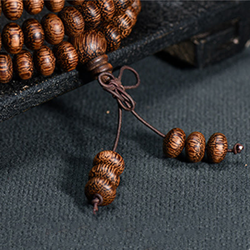 Buddha Stones Mala con 108 perline di legno testurizzate per un'energia calmante - image 6