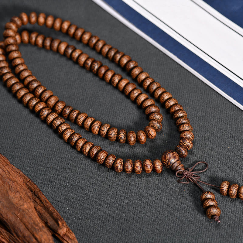 Buddha Stones Mala con 108 perline di legno testurizzate per un'energia calmante - image 3
