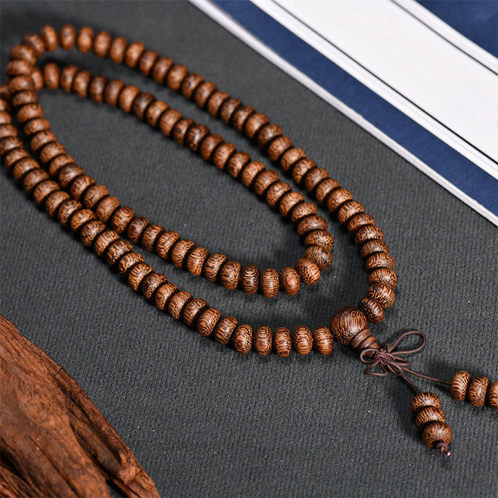 Buddha Stones Mala con 108 perline di legno testurizzate per un'energia calmante - image 3