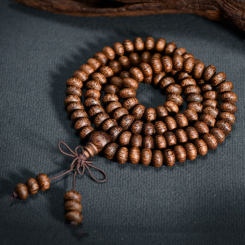 Buddha Stones Mala con 108 perline di legno testurizzate per un'energia calmante - image 4