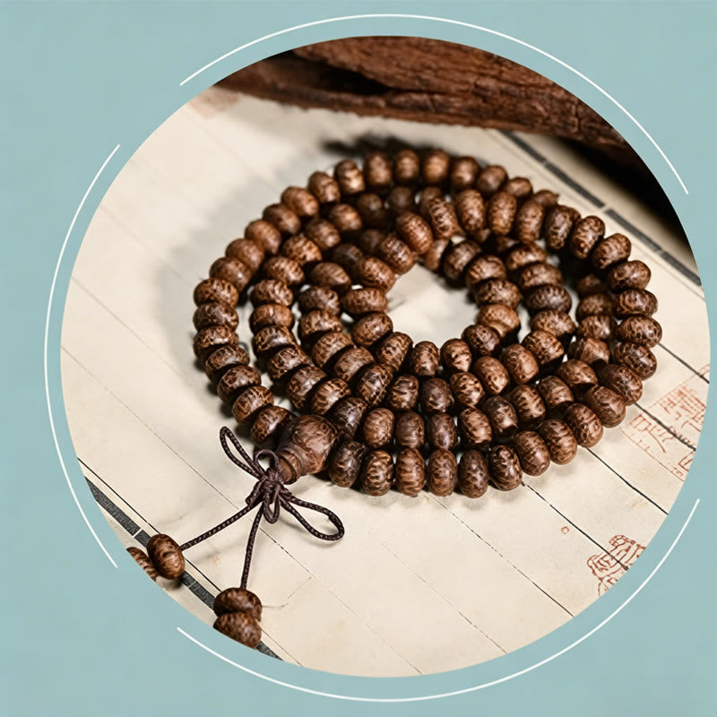 Buddha Stones Mala con 108 perline di legno testurizzate per un'energia calmante - image 8
