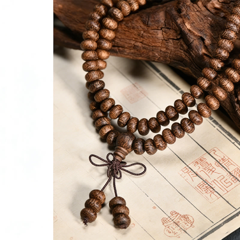 Buddha Stones Mala con 108 perline di legno testurizzate per un'energia calmante - image 9