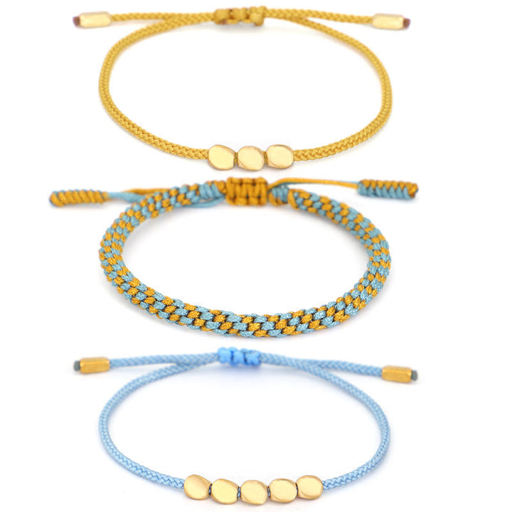 Buddha Stones Braccialetto curativo con 3 perline blu, gialle e color rame dorato, con filo blu e giallo. - image 12