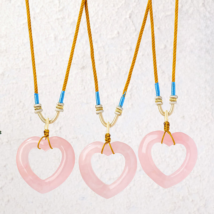 Buddha Stones Collana con ciondolo a forma di cuore cavo in quarzo rosa naturale. - image 0