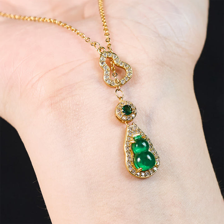 Collana con ciondolo a forma di bilancia in rame e zucca colorata con design cavo Buddha Stones. - image 1