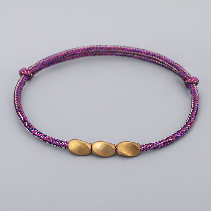 Buddha Stones Bracciale con perline di rame dorato e filo multicolore. - Rosa scuro - image 4