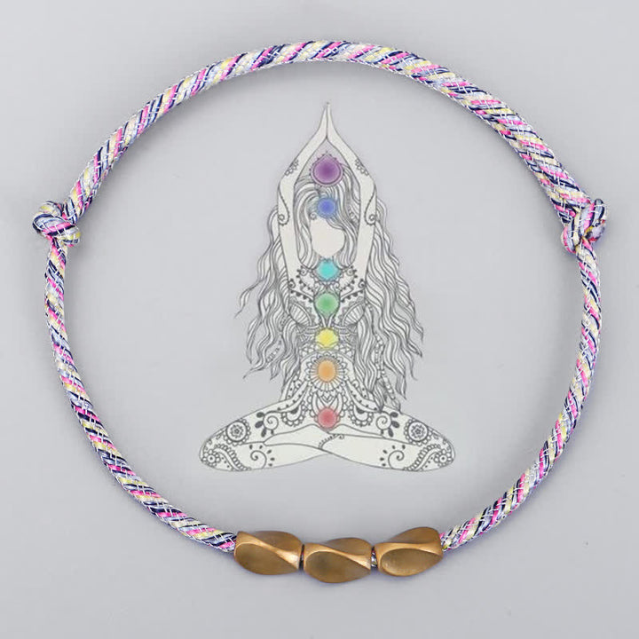 Buddha Stones Bracciale con perline di rame dorato e filo multicolore. - image 1