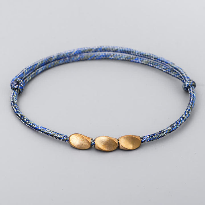 Buddha Stones Bracciale con perline di rame dorato e filo multicolore. - Blu scuro - image 10