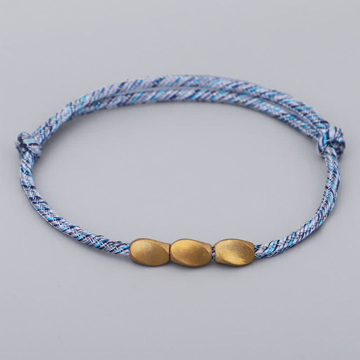 Buddha Stones Bracciale con perline di rame dorato e filo multicolore. - Blu celeste - image 6
