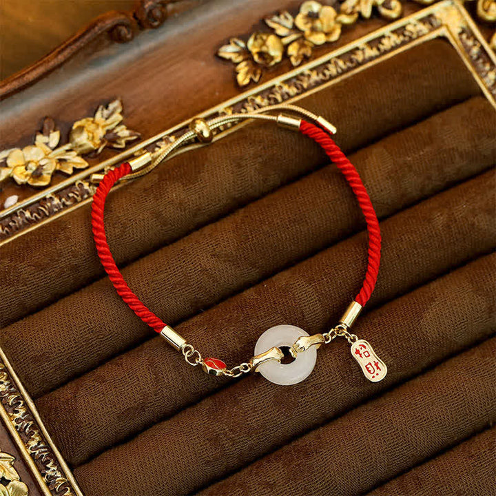 Buddha Stones Braccialetto portafortuna intrecciato con giada bianca e filo rosso, con carattere Fu. - image 3