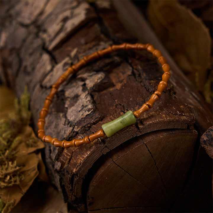 Buddha Stones Bracciale protettivo con nocciolo di oliva naturale, peridoto e design in bambù - image 2