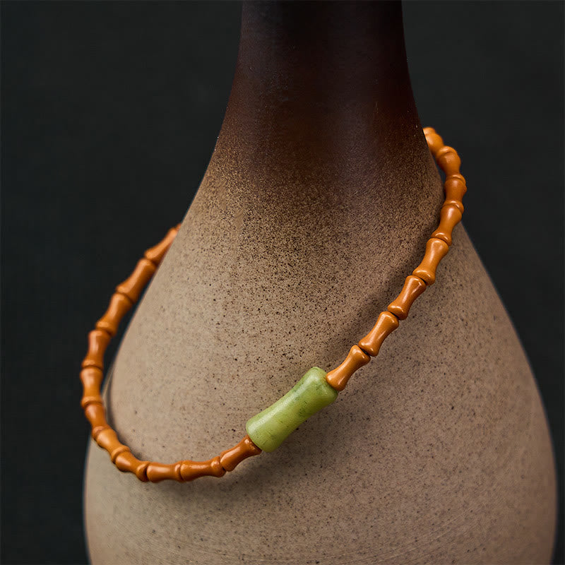 Buddha Stones Bracciale protettivo con nocciolo di oliva naturale, peridoto e design in bambù - image 1