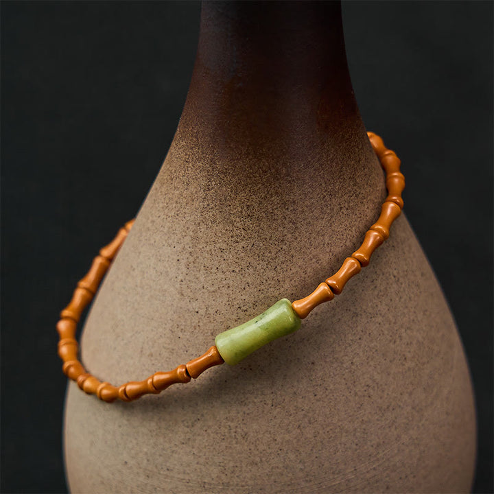 Buddha Stones Bracciale protettivo con nocciolo di oliva naturale, peridoto e design in bambù - Nocciolo d'oliva (circonferenza del polso 15-16 cm) - image 0