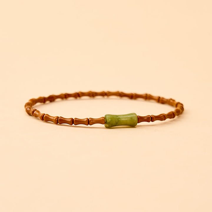 Buddha Stones Bracciale protettivo con nocciolo di oliva naturale, peridoto e design in bambù - image 4