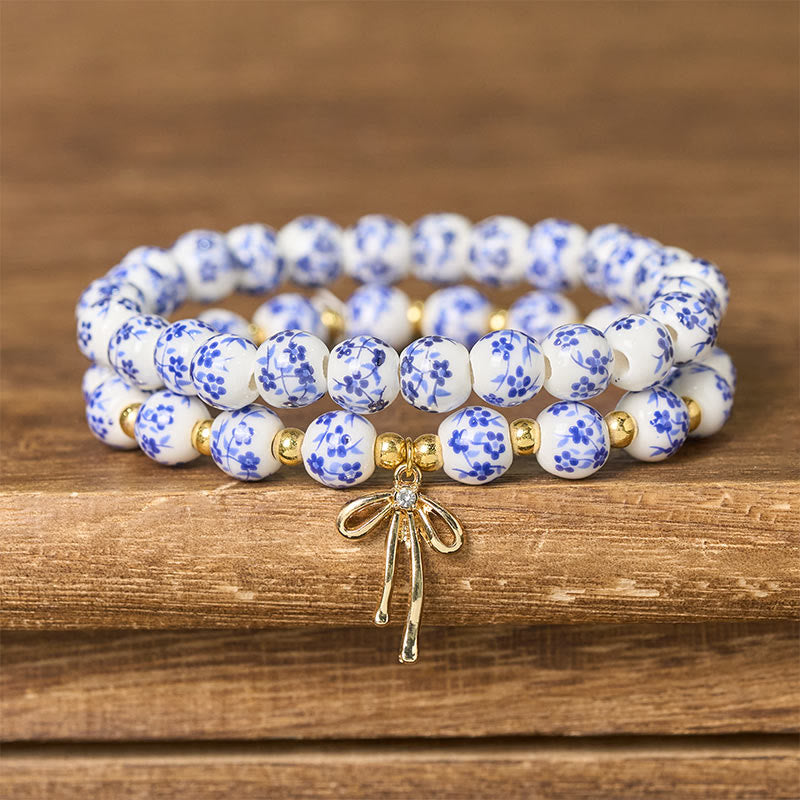 Buddha Stones Braccialetto con fiocco di perline di porcellana blu, bianca e rosa, con perline, simbolo della pace interiore. - Blu e bianco (Circonferenza del polso: 15-16 cm) - image 0