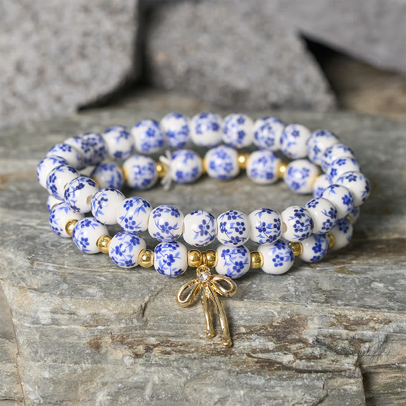 Buddha Stones Braccialetto con fiocco di perline di porcellana blu, bianca e rosa, con perline, simbolo della pace interiore. - image 1
