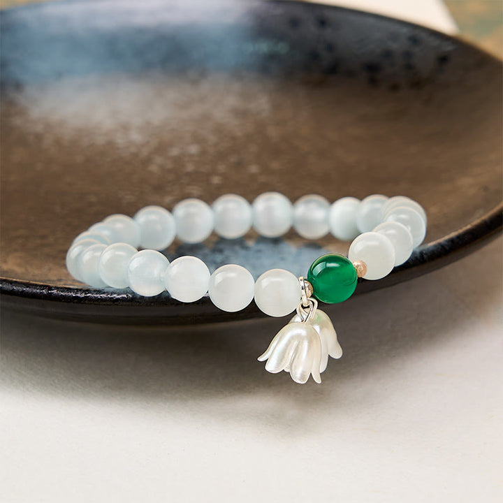 Buddha Stones Braccialetto con perline rotonde bianche occhio di gatto da 8 mm e fiori di mughetto. - image 3