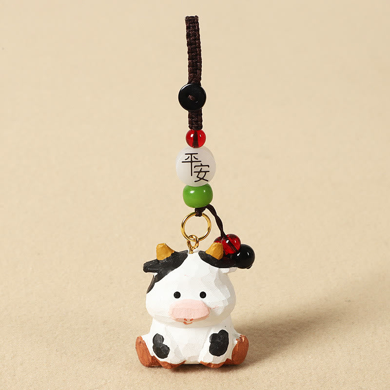 Buddha Stones Portachiavi in ​​legno di tiglio inciso con zodiaco cinese, fiore di pruno, pace e sicurezza, Om Mani Padme Hum, simbolo positivo. - Ox 4cm (Colore, forma e dimensioni possono variare) - Pace e sicurezza - image 12