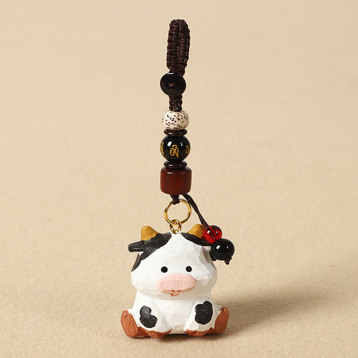 Buddha Stones Portachiavi in ​​legno di tiglio inciso con zodiaco cinese, fiore di pruno, pace e sicurezza, Om Mani Padme Hum, simbolo positivo. - Ox 4cm (Colore, forma e dimensioni possono variare) - Om Mani Padme Hum - image 10
