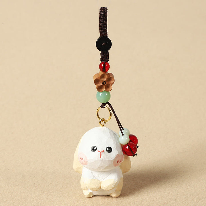 Buddha Stones Portachiavi in ​​legno di tiglio inciso con zodiaco cinese, fiore di pruno, pace e sicurezza, Om Mani Padme Hum, simbolo positivo. - Coniglio di 4 cm (colore, forma e dimensioni possono variare) - Fiore di pruno - image 17
