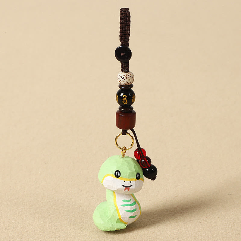 Buddha Stones Portachiavi in ​​legno di tiglio inciso con zodiaco cinese, fiore di pruno, pace e sicurezza, Om Mani Padme Hum, simbolo positivo. - Serpente di 4 cm (colore, forma e dimensioni possono variare) - Om Mani Padme Hum - image 22