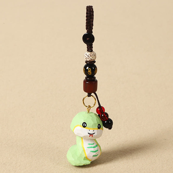 Buddha Stones Portachiavi in ​​legno di tiglio inciso con zodiaco cinese, fiore di pruno, pace e sicurezza, Om Mani Padme Hum, simbolo positivo. - Serpente di 4 cm (colore, forma e dimensioni possono variare) - Om Mani Padme Hum - image 22