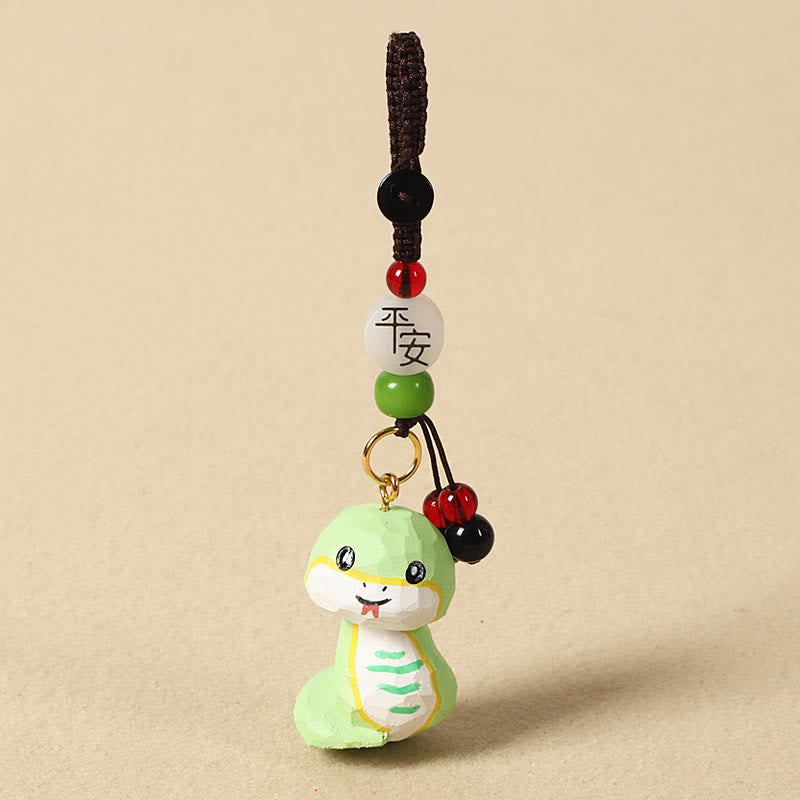 Buddha Stones Portachiavi in ​​legno di tiglio inciso con zodiaco cinese, fiore di pruno, pace e sicurezza, Om Mani Padme Hum, simbolo positivo. - Serpente di 4 cm (colore, forma e dimensioni possono variare) - Pace e sicurezza - image 25