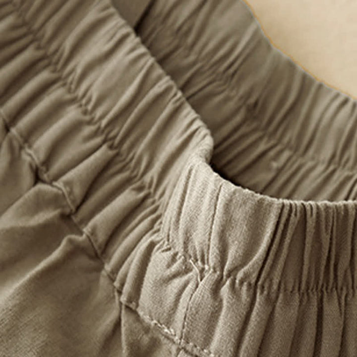 Buddha Stones Pantaloncini estivi minimalisti da donna con bottoni, elastico in vita e tasche. - image 3