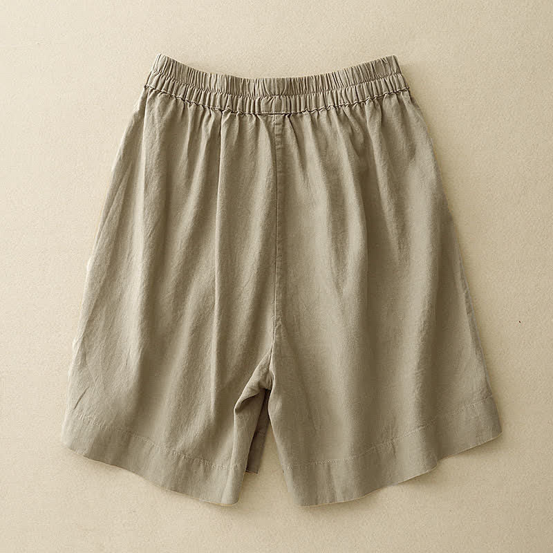 Buddha Stones Pantaloncini estivi minimalisti da donna con bottoni, elastico in vita e tasche. - image 1