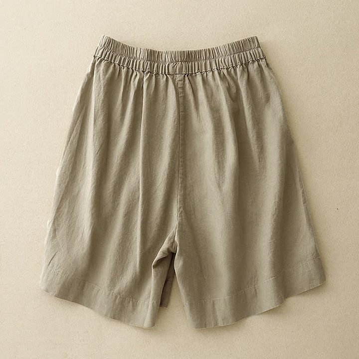 Buddha Stones Pantaloncini estivi minimalisti da donna con bottoni, elastico in vita e tasche. - image 1
