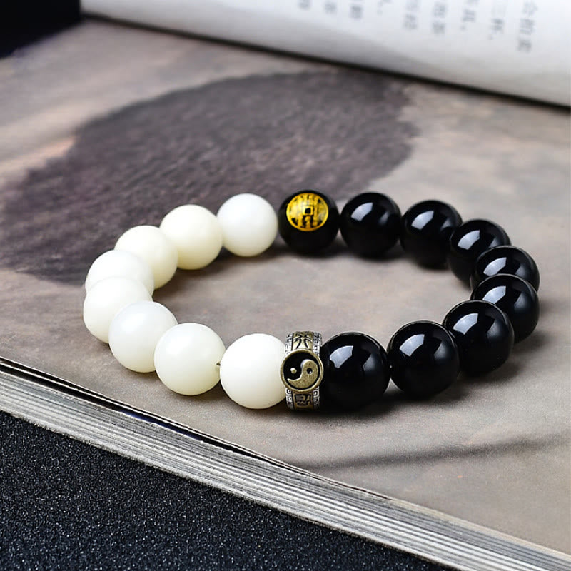 Buddha Stones Braccialetto di forza con semi di Bodhi in ossidiana nera, mantra Yin Yang a nove caratteri, fantasmi di montagna, soldi, spendi - Seme di Bodhi in ossidiana nera - 12 mm (Circonferenza del polso: 17-18 cm) - image 0