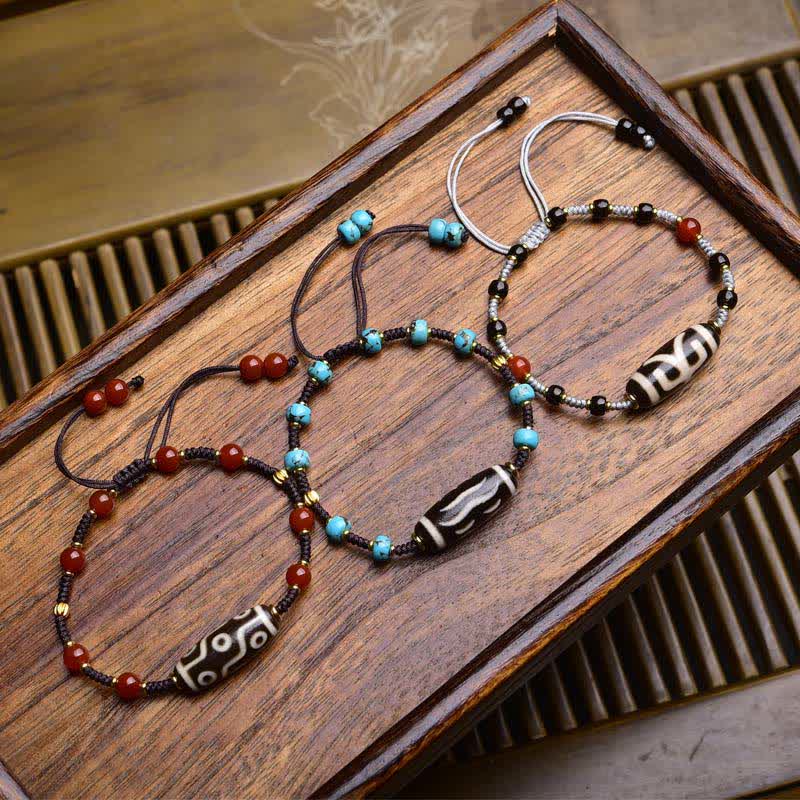 Buddha Stones Bracciale protettivo in corda intrecciata con perline Dzi e agata rossa del sud - image 0