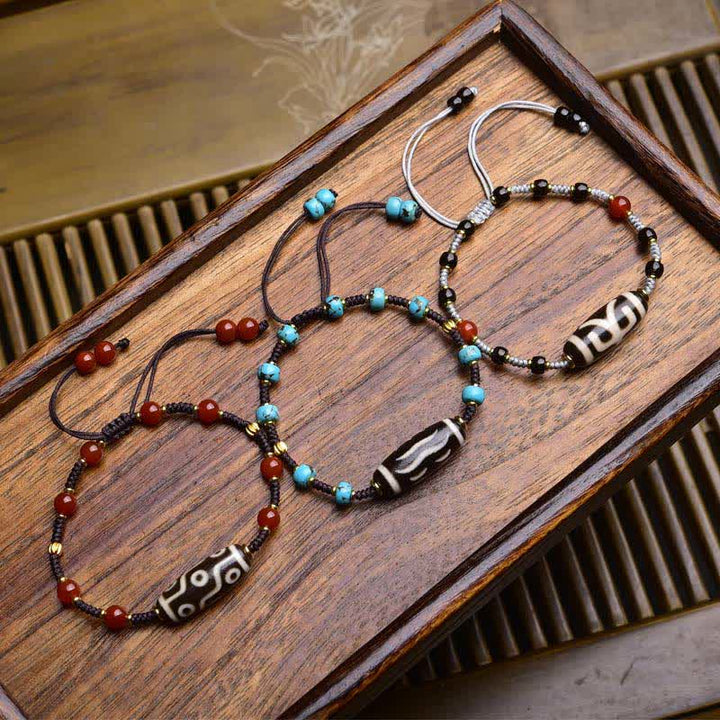 Buddha Stones Bracciale protettivo in corda intrecciata con perline Dzi e agata rossa del sud - image 0